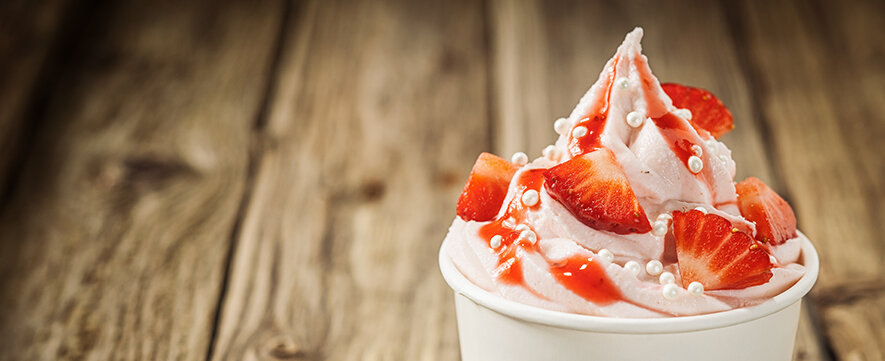 ice cream with strawberry slices on top